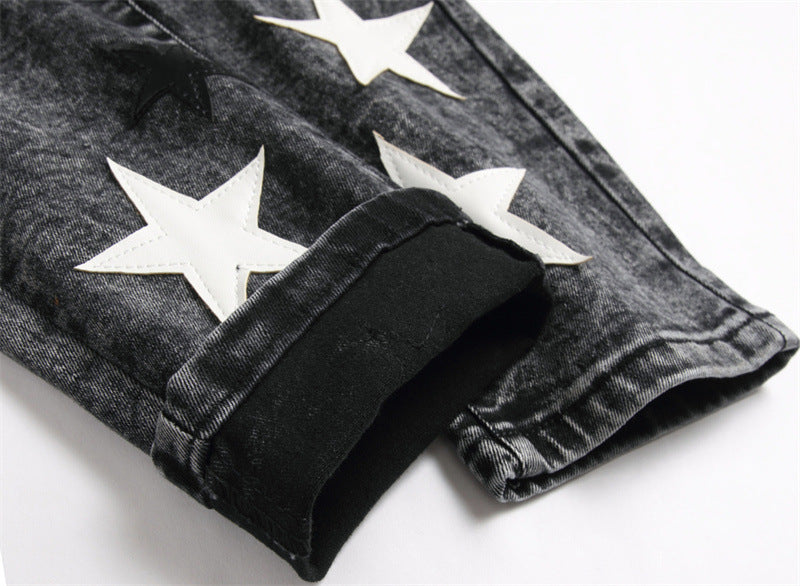 Five-pointed Star patched ripped jean trousers